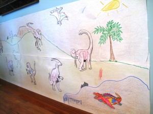 Giant wall banner filled with colored dinosaurs