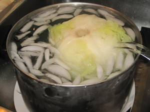 Cooling the cooked whole cabbage